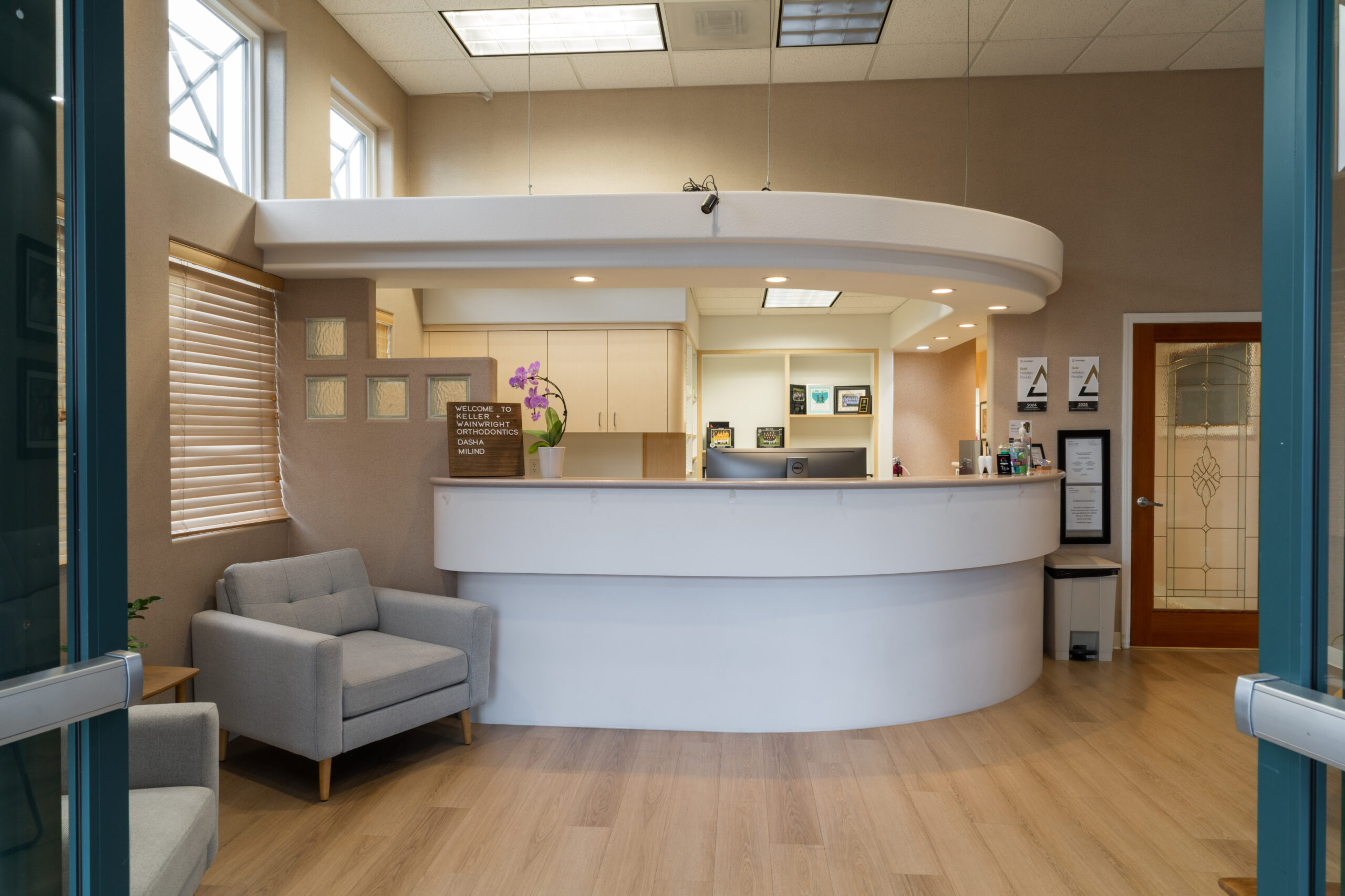 Reception area at Keller & Wainwright Orthodontics in Sunnyvale, CA with chairs and desk